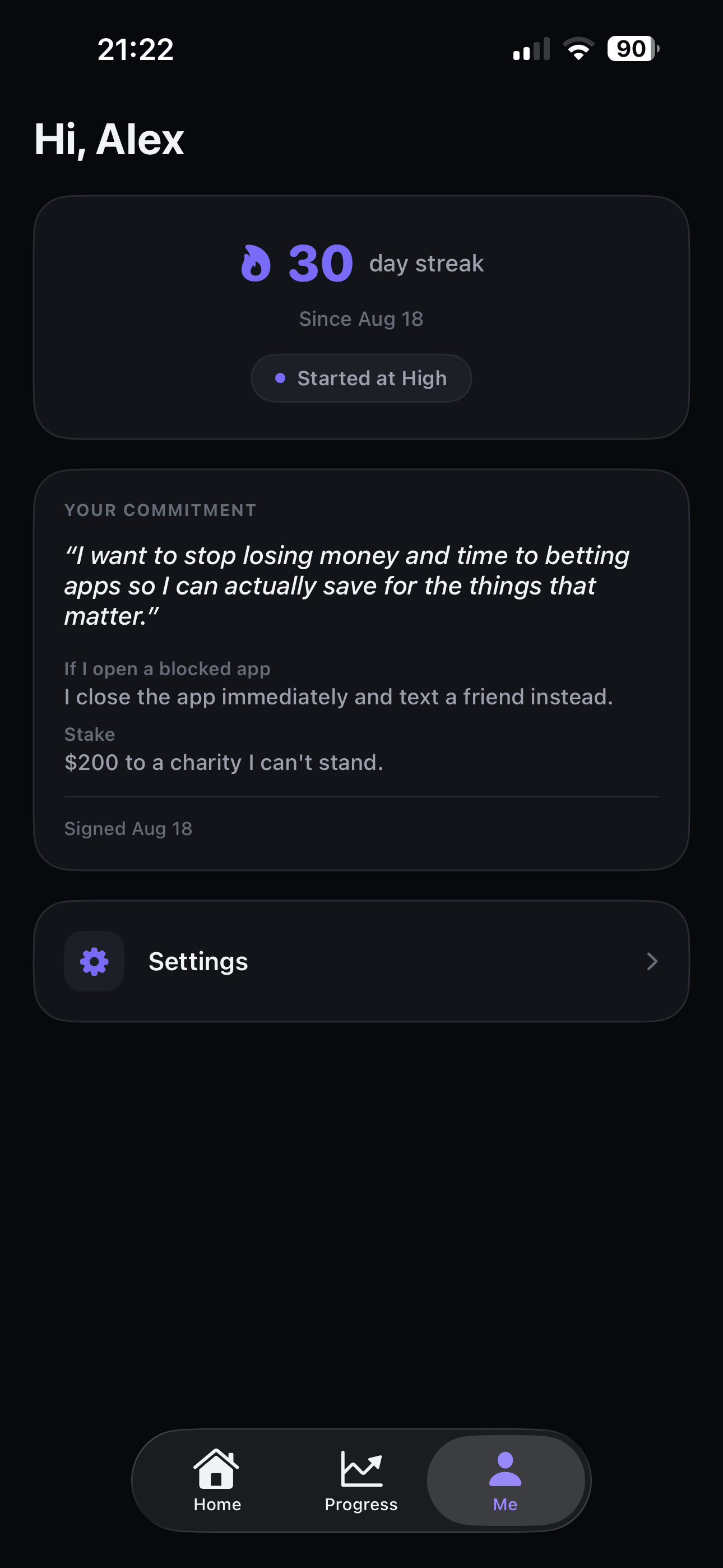 RESET commitment screen showing a signed promise and a stake of $200 to a charity